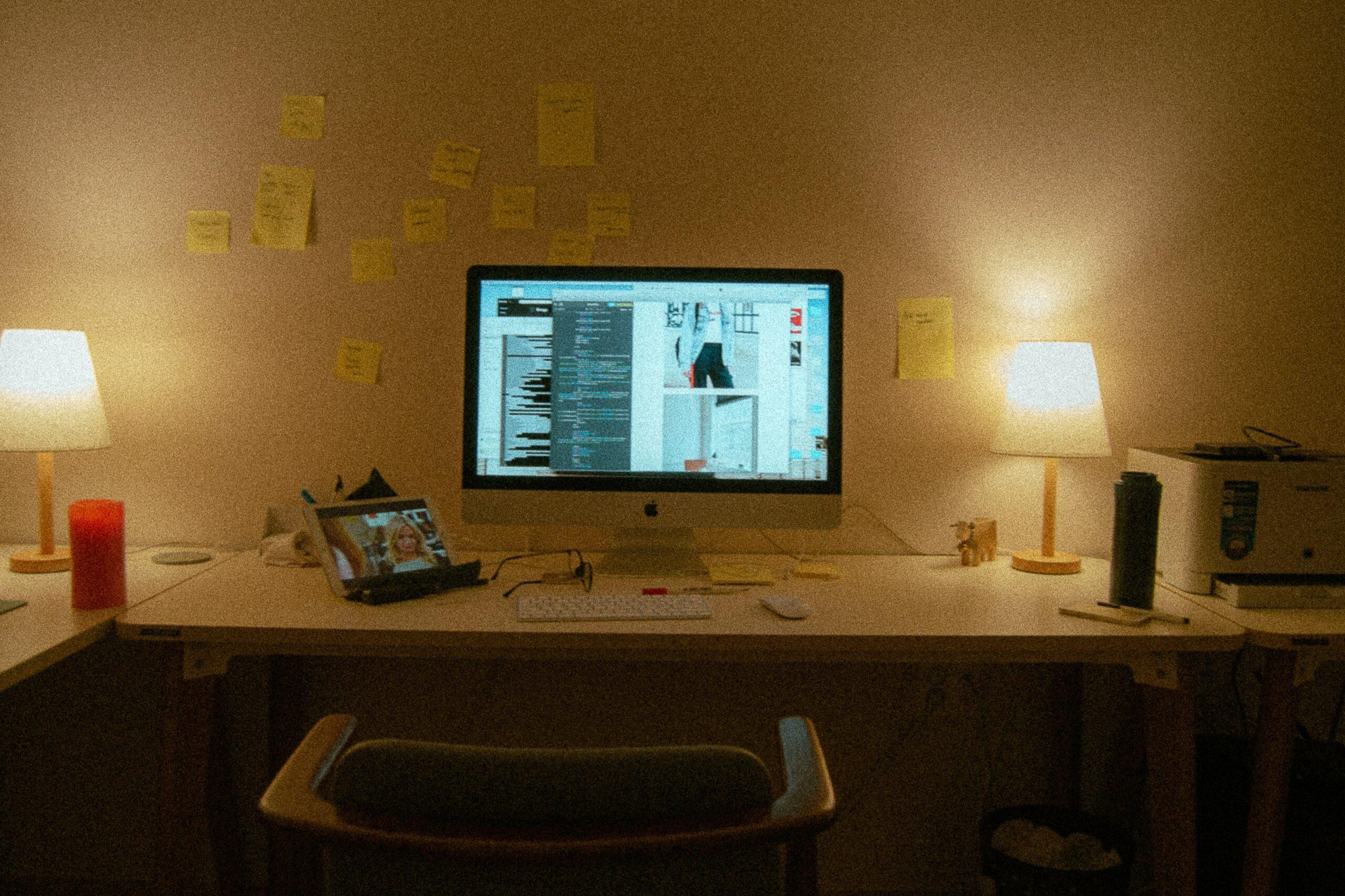 A desk setup featuring a high-quality webcam, ring light, and microphone