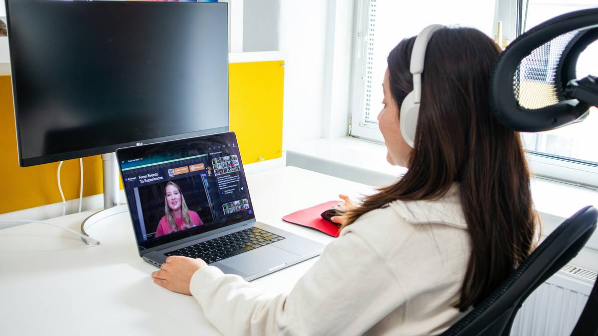 A mic positioned near a laptop and mixer for optimal audio testing