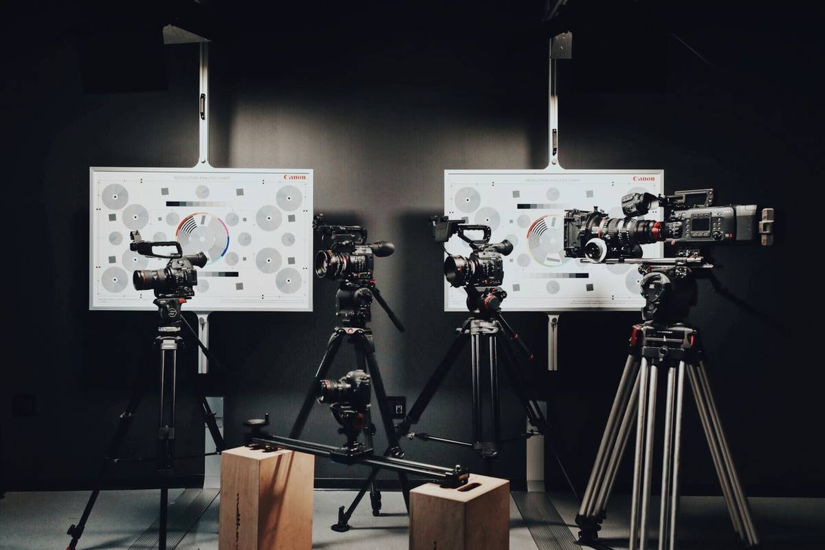 A high-quality home streaming setup including camera, mic, and green screen.