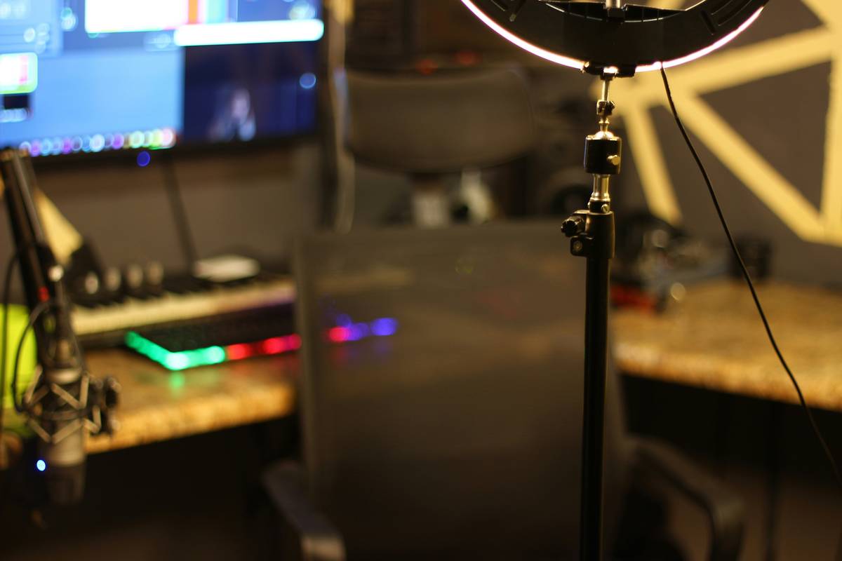 Image of a professional streaming setup including camera, ring light, and mic