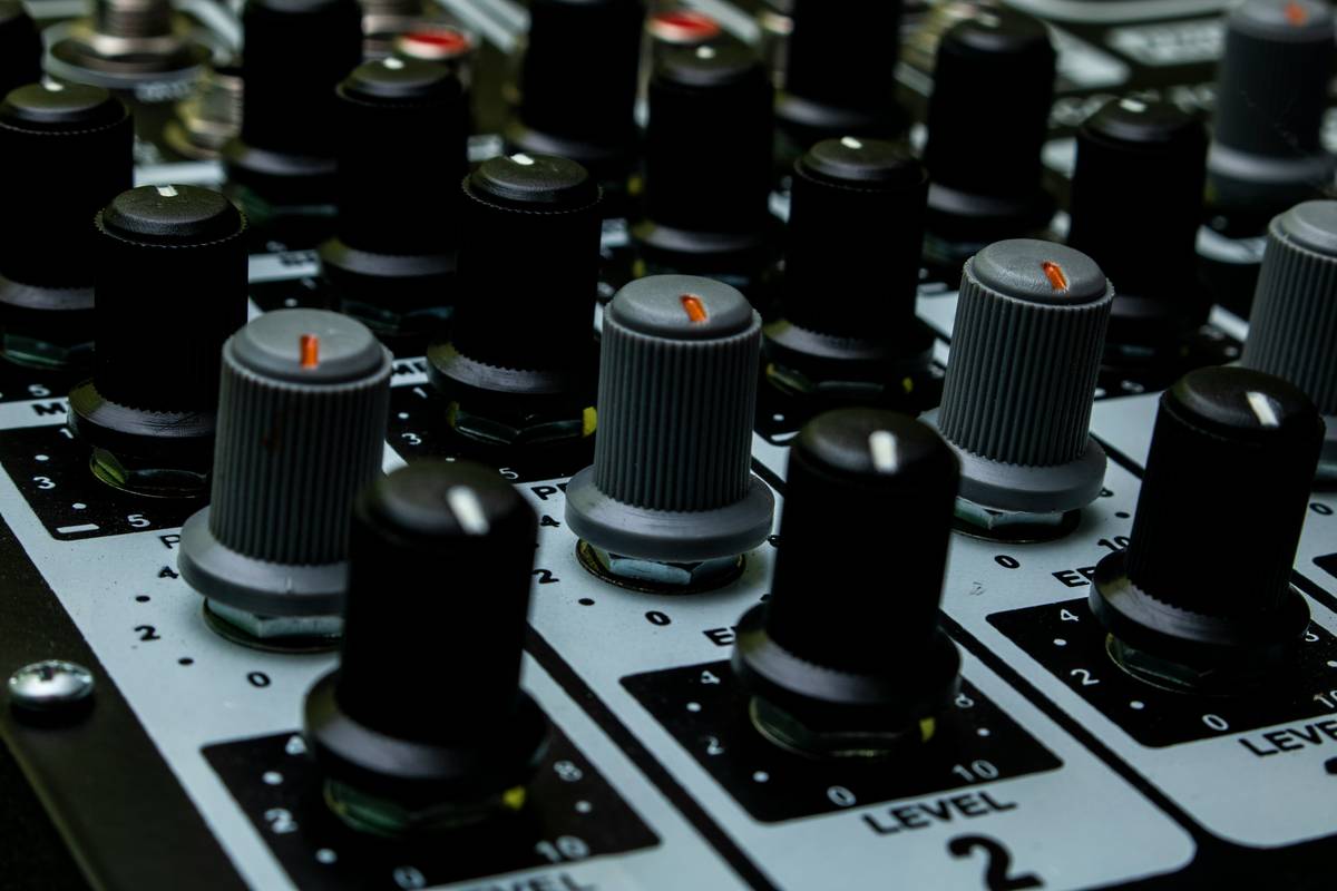 A close-up photo showing a camera, mic, and lighting kit arranged neatly on a desk.