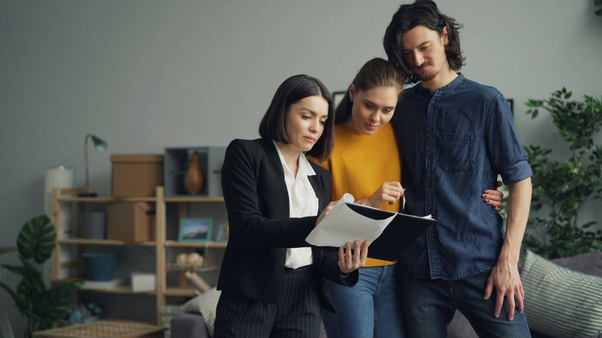 a group of people looking at a piece of paper