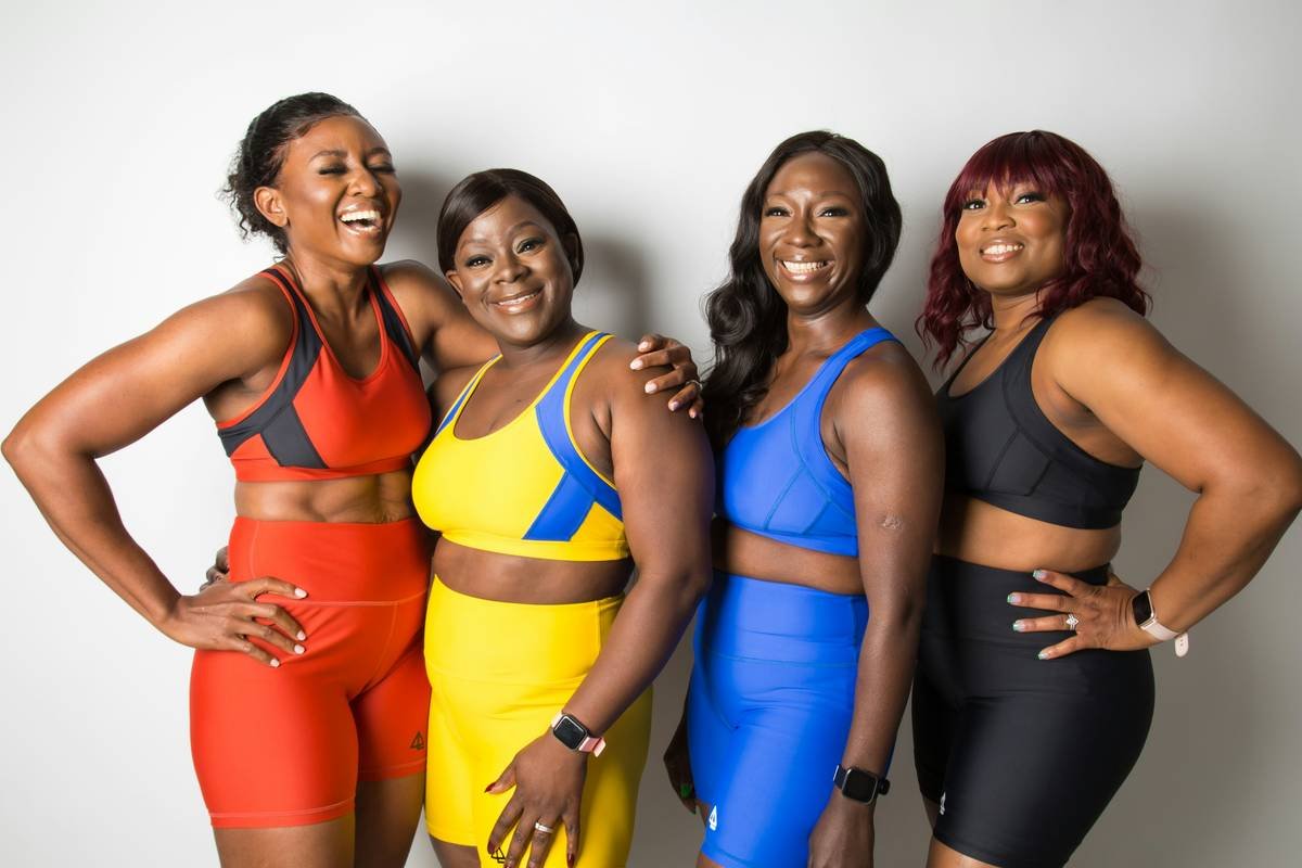 Happy Black women wearing April Laugh Fitness bra and short